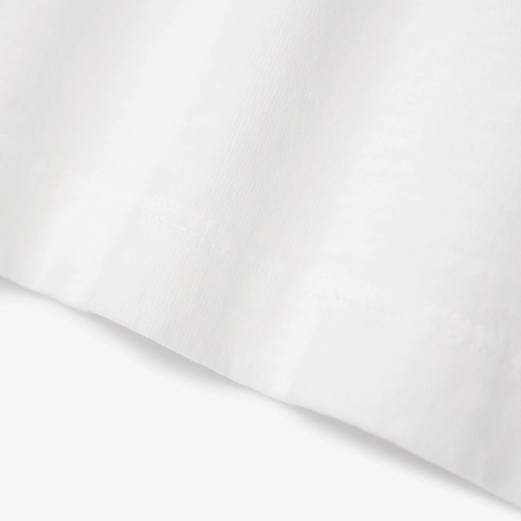 White fabric with a subtle texture on a white background