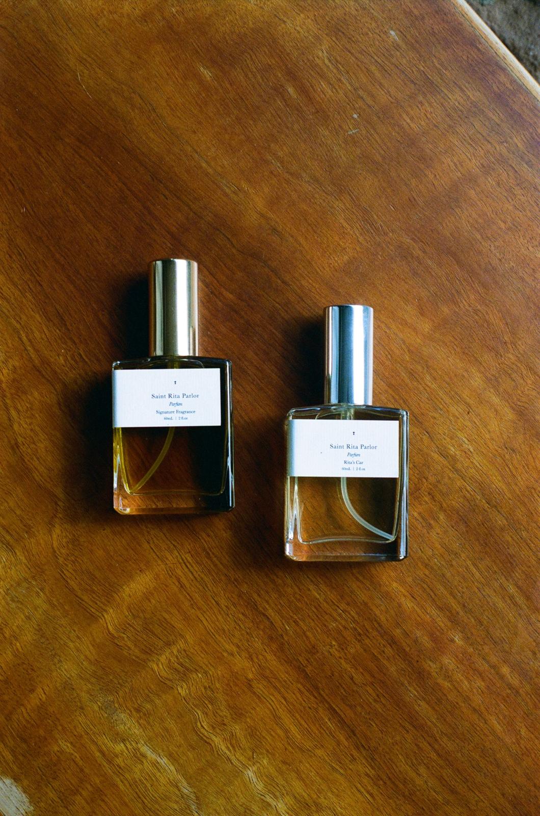Saint Rita Parlor fragrances lying flat on table in-store