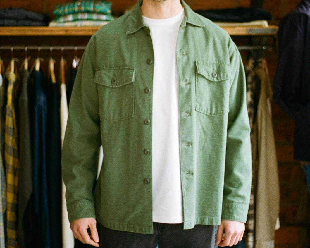 Orslow green army shirt being worn in-store