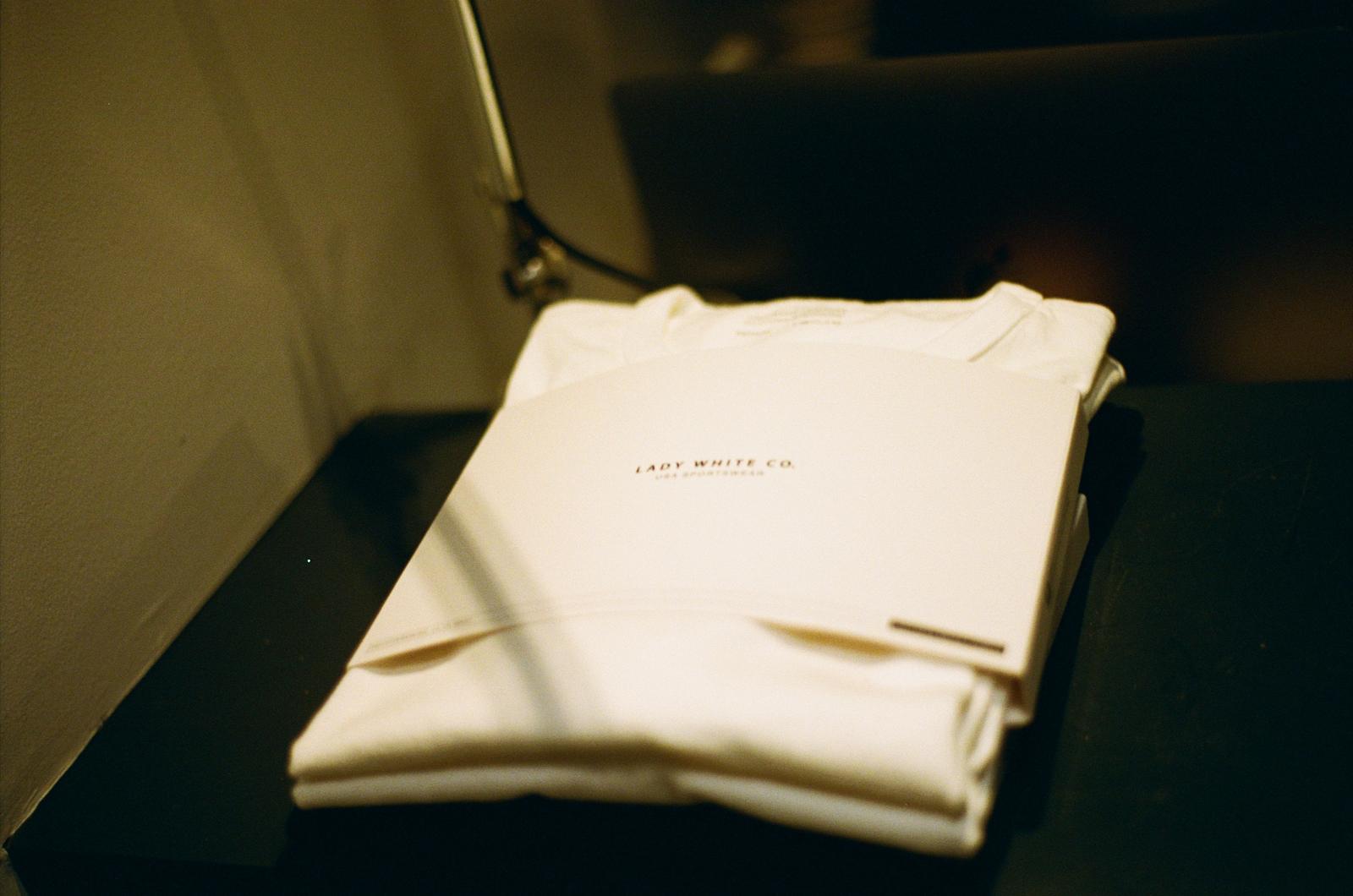 Lady White Co. t-shirts stacked on top of each other